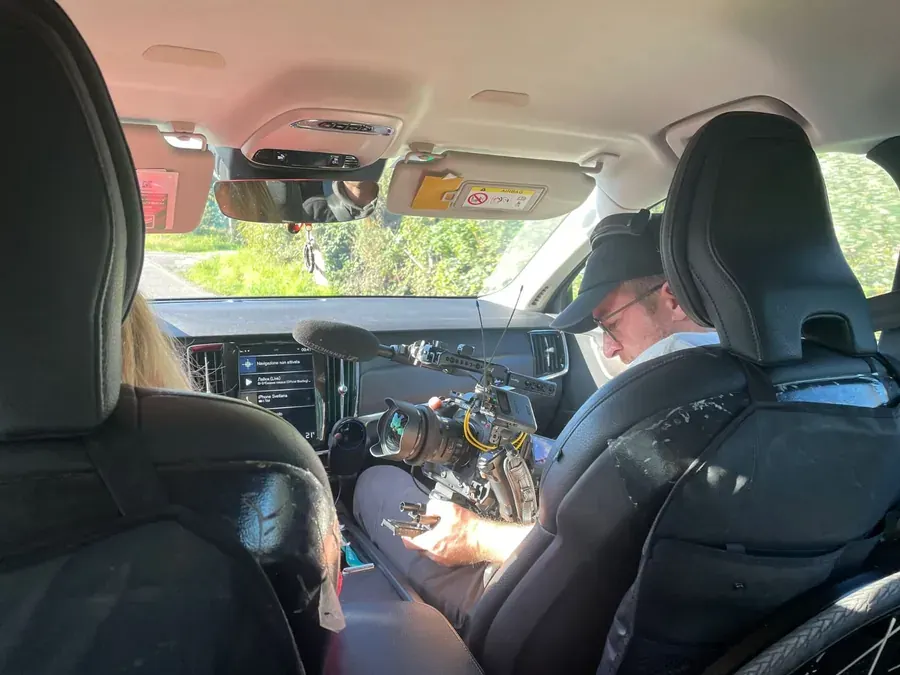 On set of Breaking Barriers: filming from the back seat of a car
